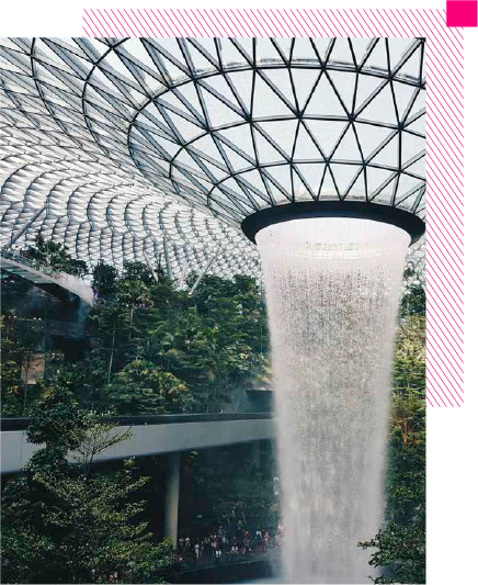 Foto de un inmueble con paisaje natural, encima se observa un recuadro magenta con el texto: “Un inmueble no puede ser verdaderamente sustentable si no es accesible” Mahesh Ramanujam Former President & CEO USGBC